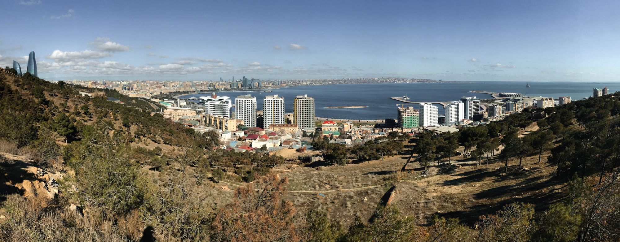 The view from the top of Bayil Hill. On the right is an oil platform; the Flame Towers are on the le ...